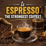 A close-up of a rich espresso shot with crema beside a cup of brewed coffee, illustrating the comparison of strength and caffeine content