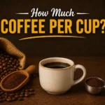 Rustic coffee-themed graphic with a coffee cup, coffee beans, and the text “How Much Coffee Per Cup?” on a dark brown background.