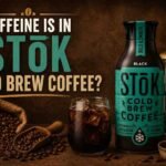 STōK Cold Brew Coffee bottle with iced coffee, coffee beans, and brewing equipment on a rustic brown background.