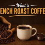 What is French Roast Coffee featured image showing dark roasted coffee beans, ground coffee, and a cup of black coffee on a brown background.